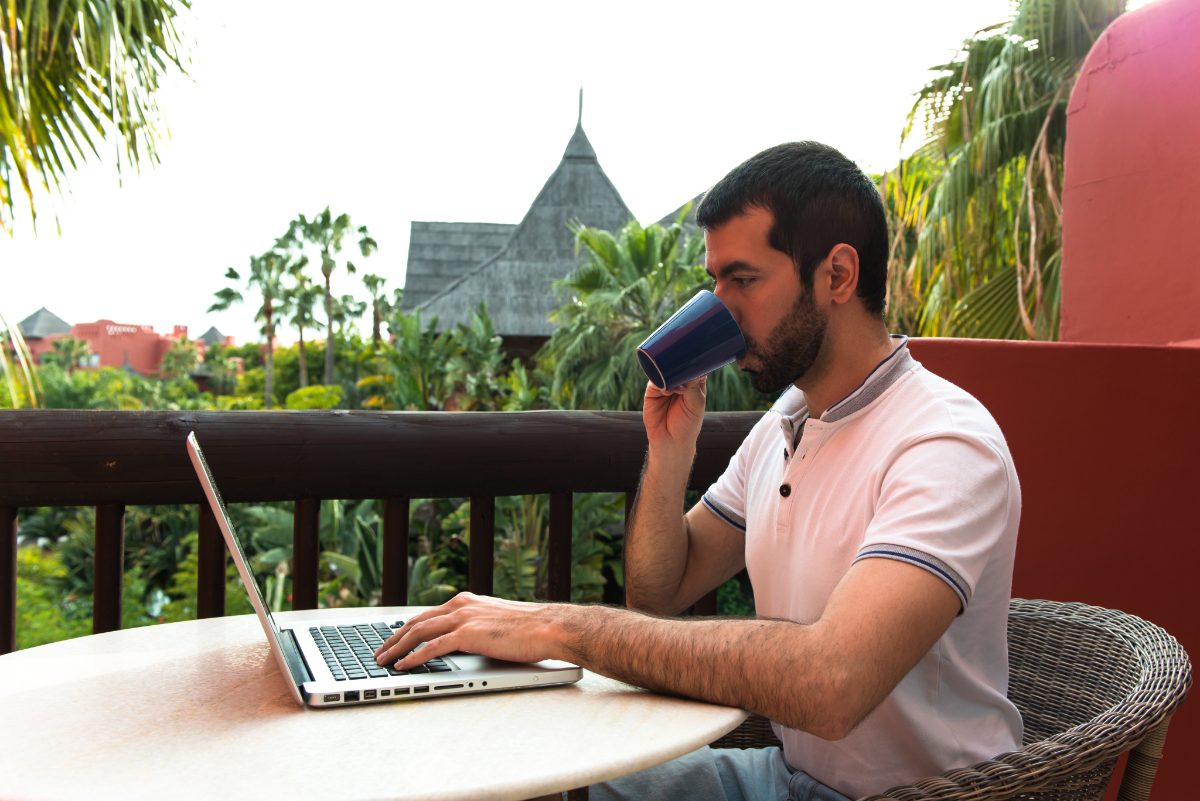 Remote worker at a laptop in a forest