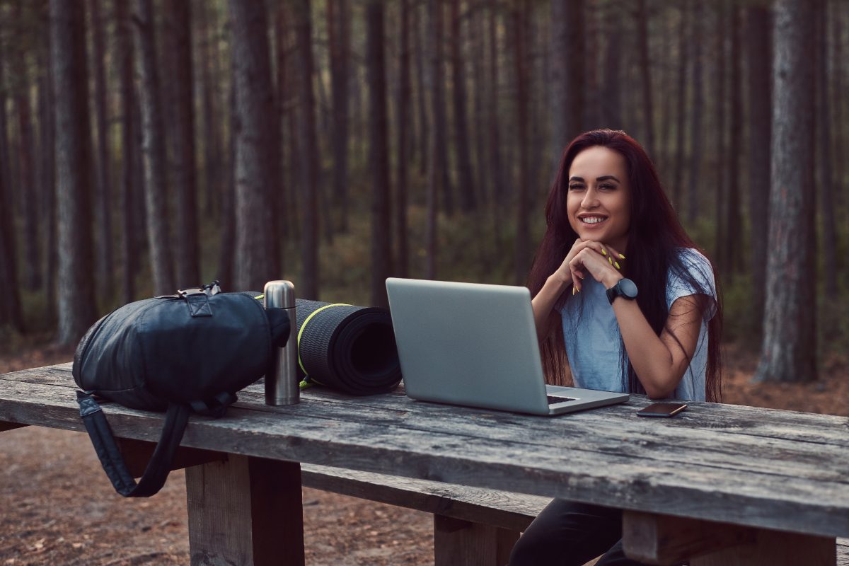 Remote worker at a laptop on a balcony